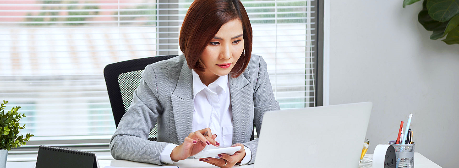 woman looking at her laptop