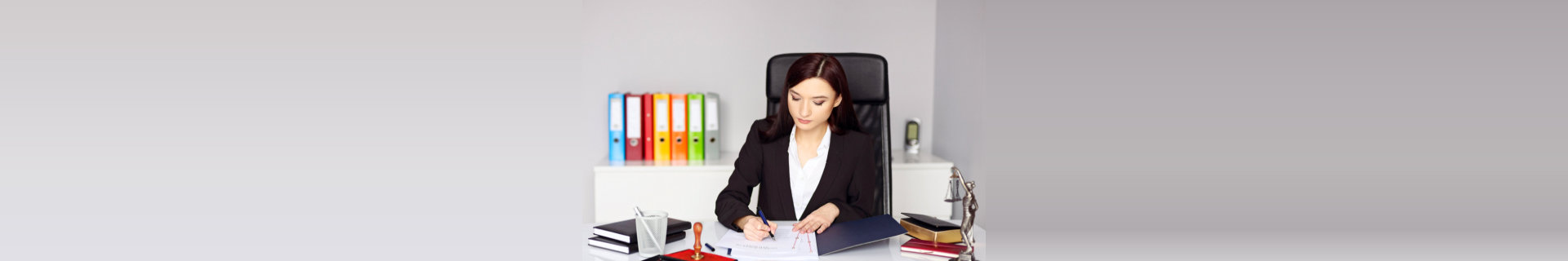 woman writing on a paper